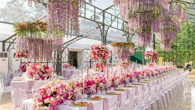 Design and Production: Bespoke Events. Pink, lilac dramatic wedding floral arrangement ceiling.