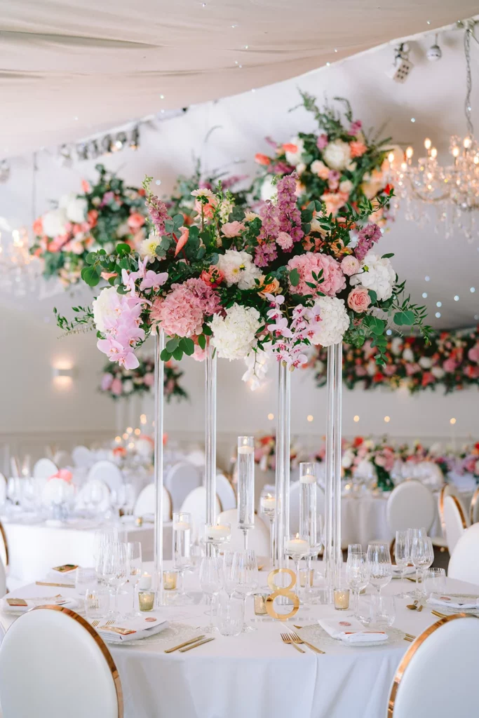 Event Planner: Charlotte Elise. Pink, dusty red, green wedding floral arrangement.