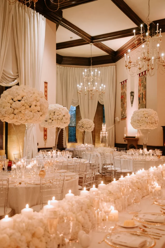 Event Planner: Charlotte Elise. all white wedding reception, white floral tubes, floral arrangement white wedding table.