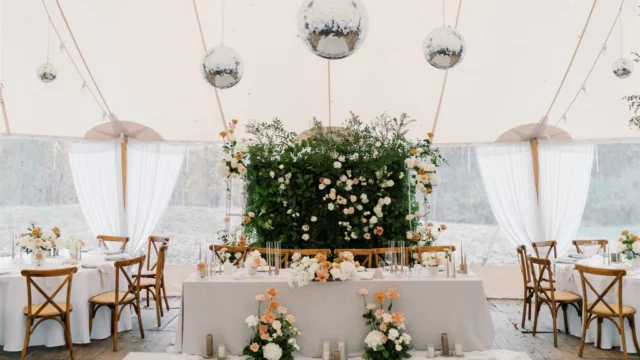 Event Planner: Amanda Costa Thompson. Green wedding backdrop, grey wedding table, wooden rustic wedding reception, disco balls wedding decorations.