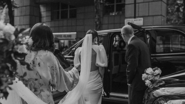 Photographer: Emma Wilder. Modern bride, London black cab, long veil.