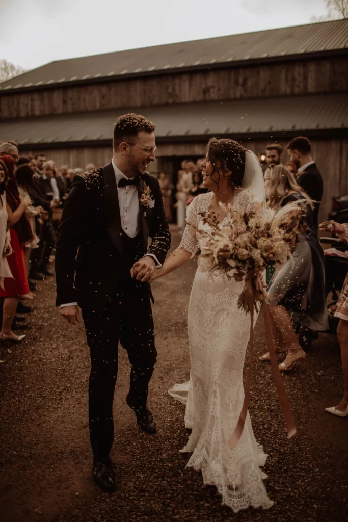 Photographer: Esme Whiteside. Rustic barn wedding ceremony reception. Boho bridal bouquet.