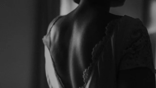 Photographer: Esme Whiteside. Black and white bride, open back dress.