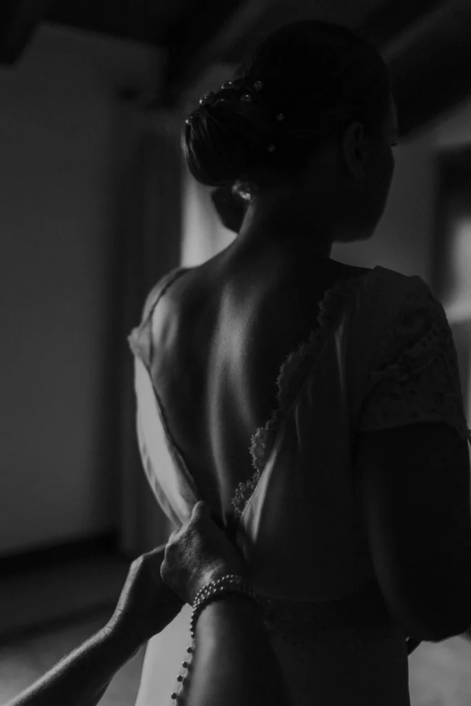 Photographer: Esme Whiteside. Black and white bride, open back dress.