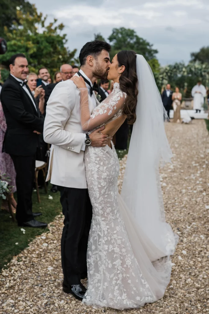 Photographer: Katie Rogers. Modern bride and groom, bride open back bridal dress, wedding ceremony.