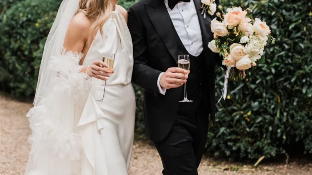 Photographer: Katie Rogers. Bride and groom, white off shoulder bridal dress, beige bridal bouquet