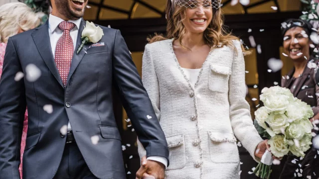 Photographer: Katie Rogers. London modern wedding reception, town hall, short bridal dress, confetti.