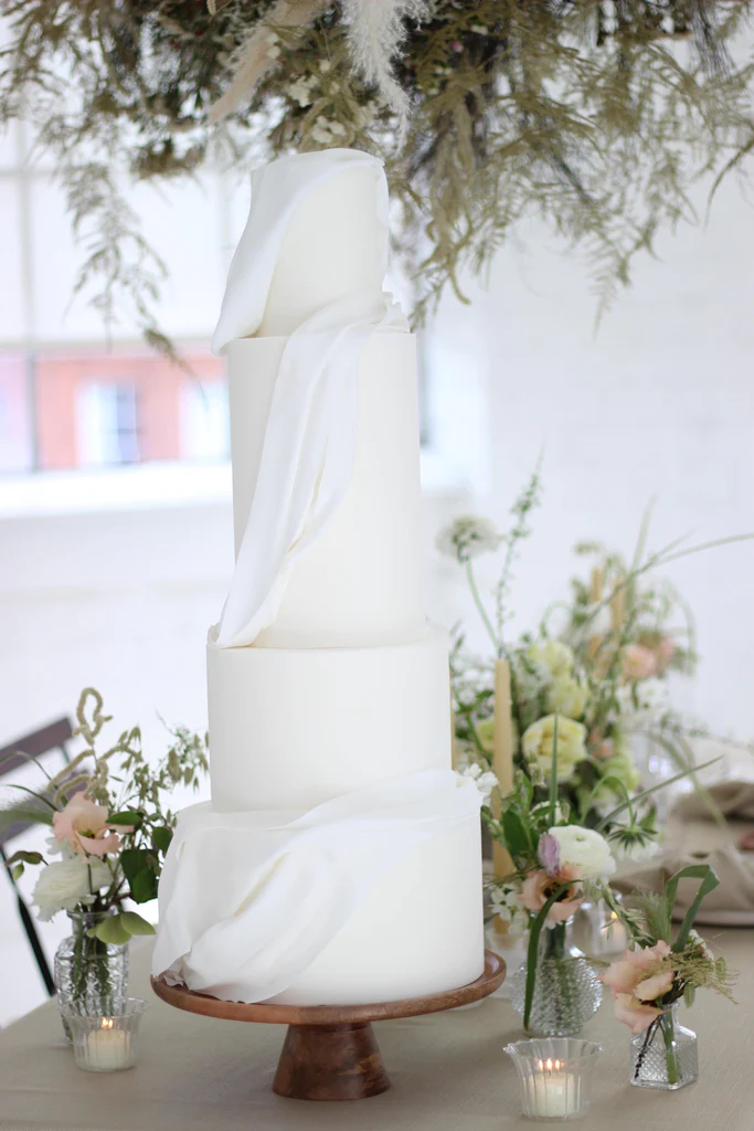 Cake Designer: Poppy Pickering Cake Design. Modern white sugar lace wedding cake.