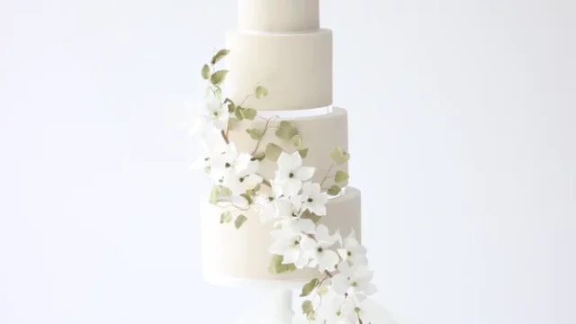 Cake Designer: Poppy Pickering Cake Design. White 5 tier wedding cake with floral decor.