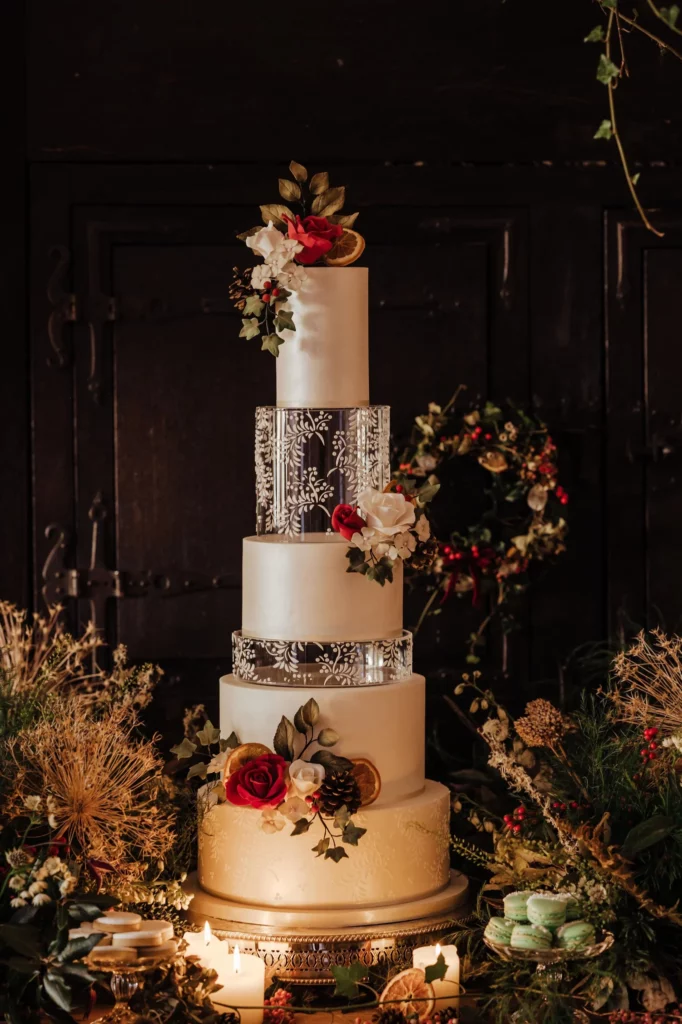 Cake Designer: RT Cakes. White and red 6 tier wedding cake.