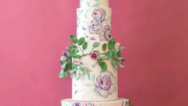 Cake Designer: Rosalind Miller Cakes. Floral decorated wedding cake 6 tiers, foliage.