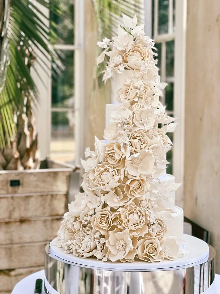 Cake Designer: Rosalind Miller Cakes. Opulent wedding cake 6 tiers, beige with sugar flowers decor.