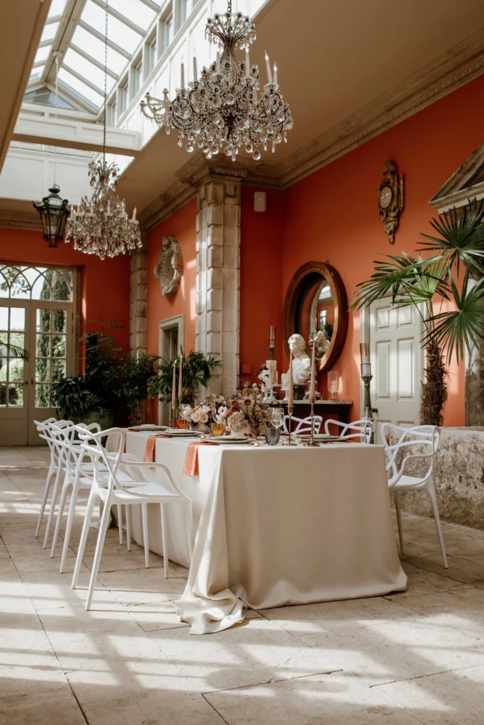 Event Planner: The Stars Inside. Modern wedding elopement table, grey and burnt orange, chandeliers.