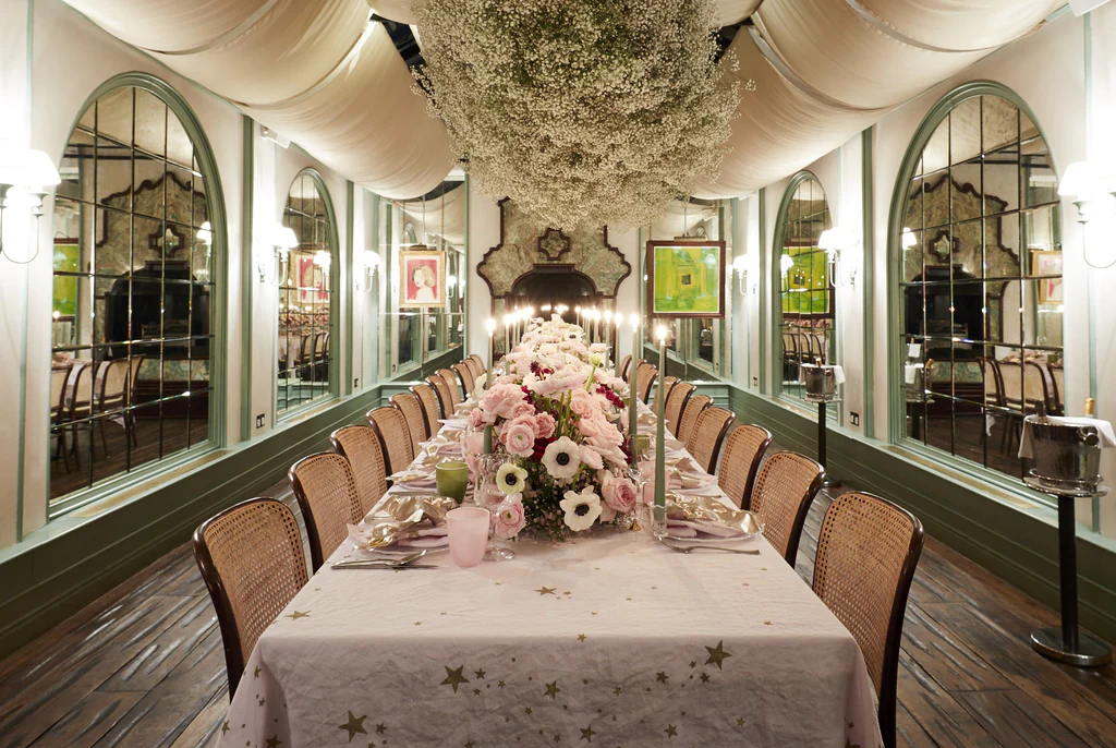 Florist: Wild At Heart. Wedding floral arrangement table, soft pink, wedding table, white handing ceiling florals.