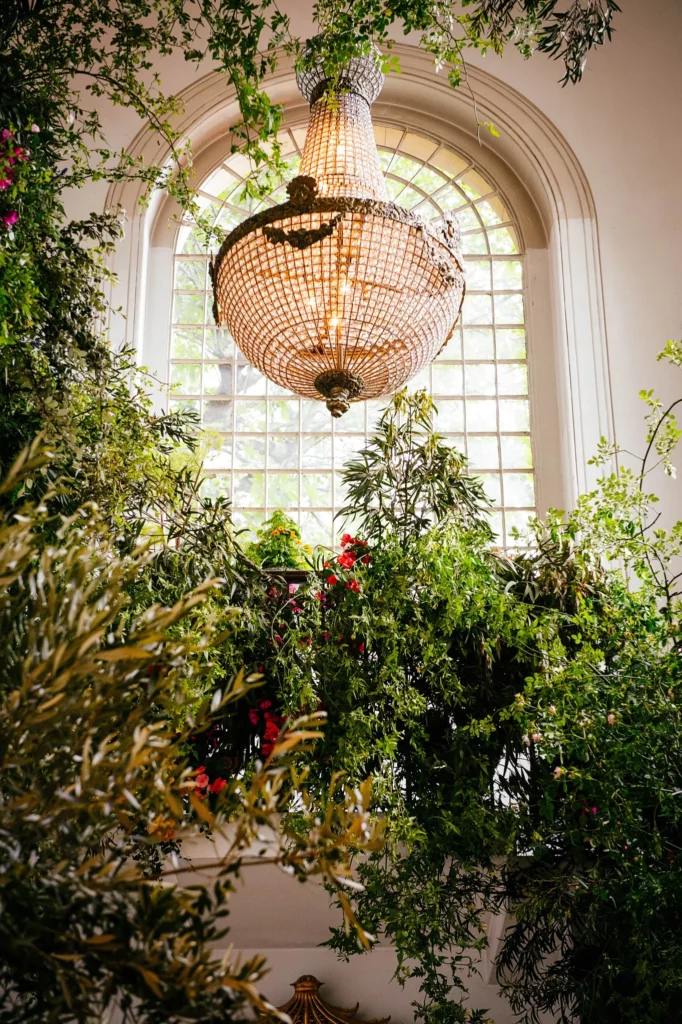 Florist: Wild At Heart. Wedding floral arrangement, foliage on staircase.